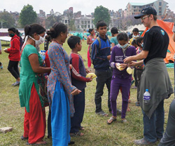 A YWAM DTS team distributes rice to displaced people in Kathmandu